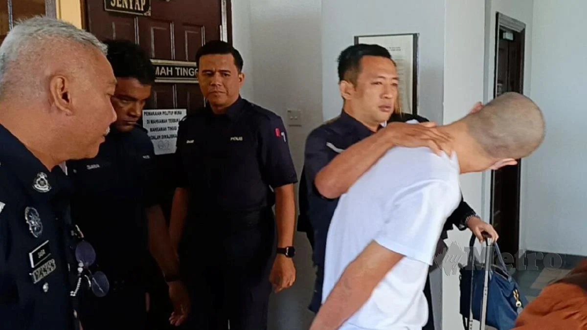 Ng chan keong escorted from courtroom