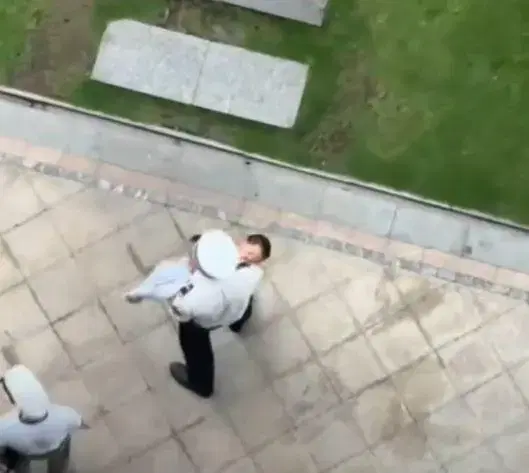 Officer carries boy who fell from 20th floor to hospital