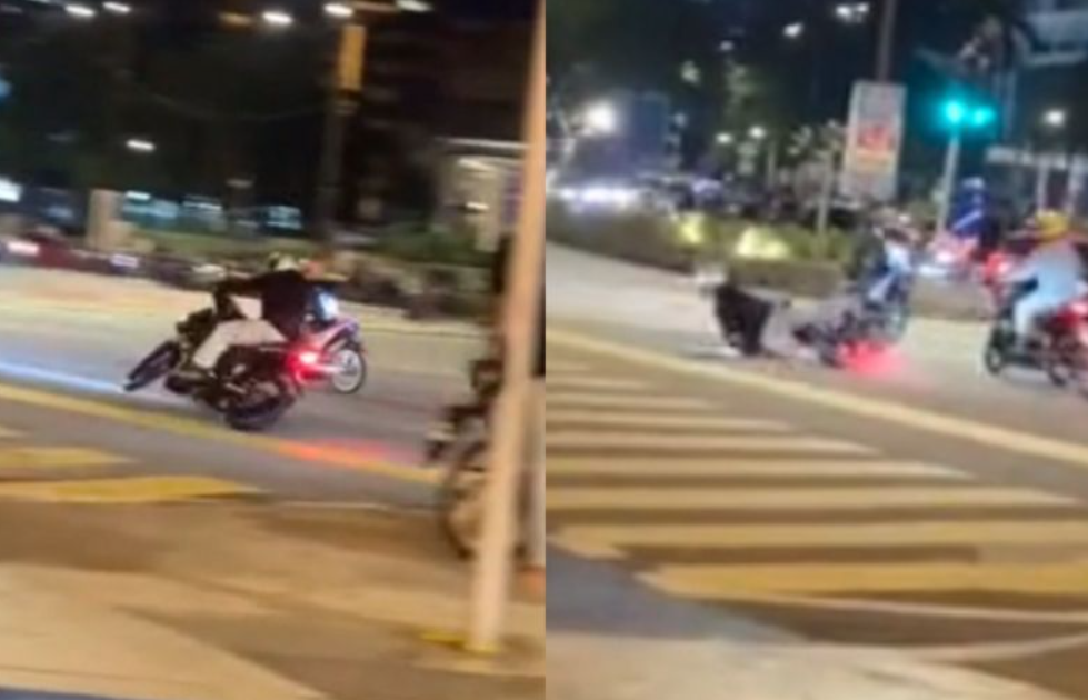 'mat rempit' falls down while doing a wheelie near klcc