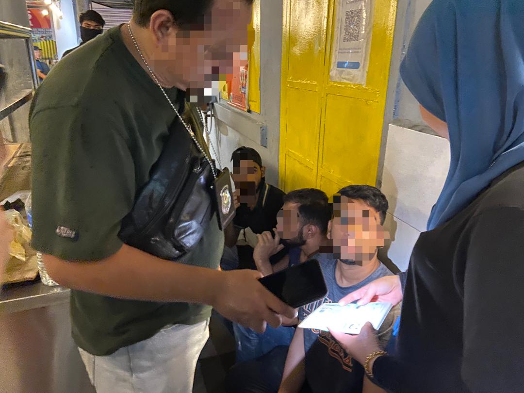 Pakistani man being questioned by Immigration officers