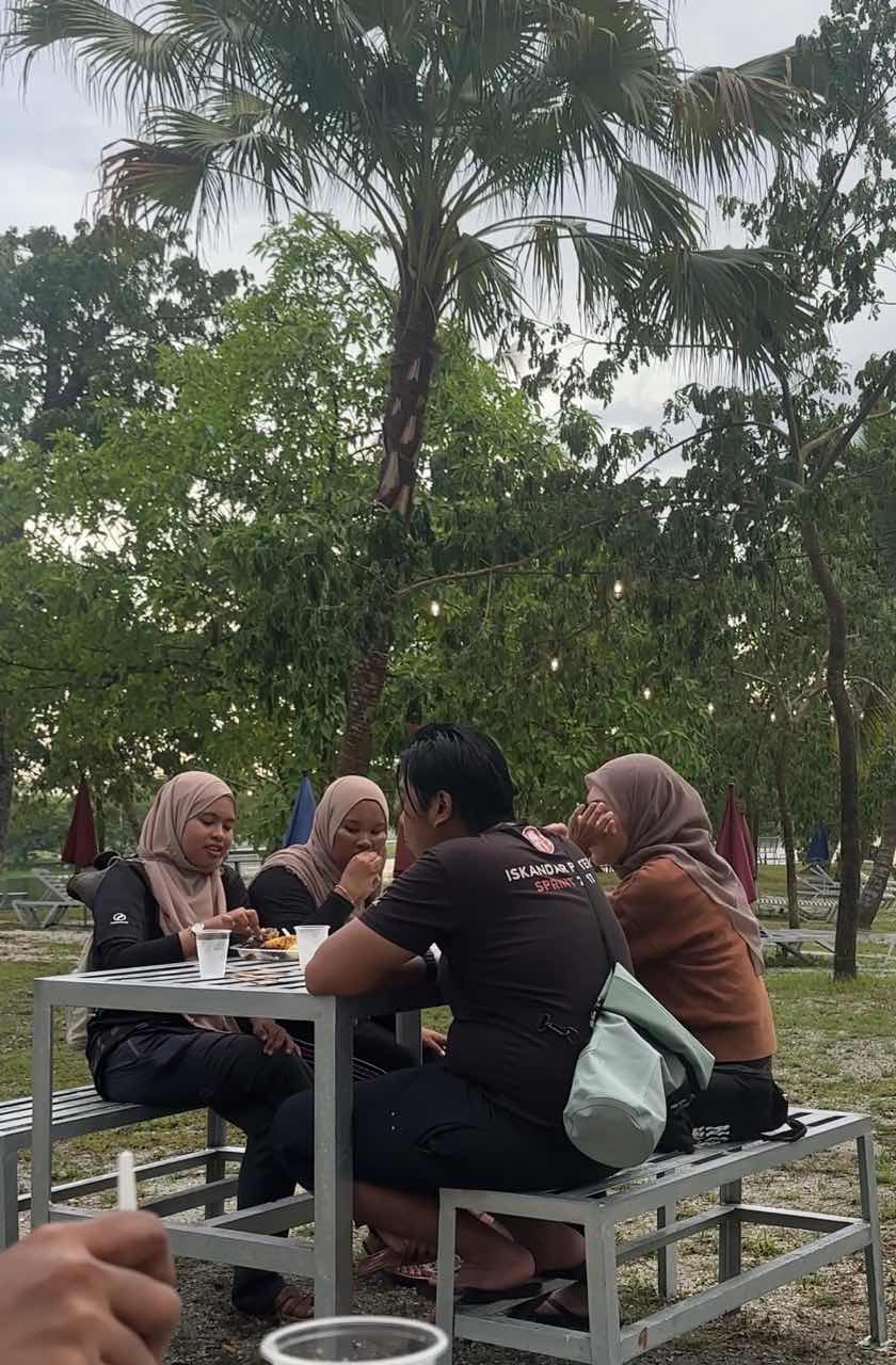 Participants eating at bbq near base camp at escape ipoh