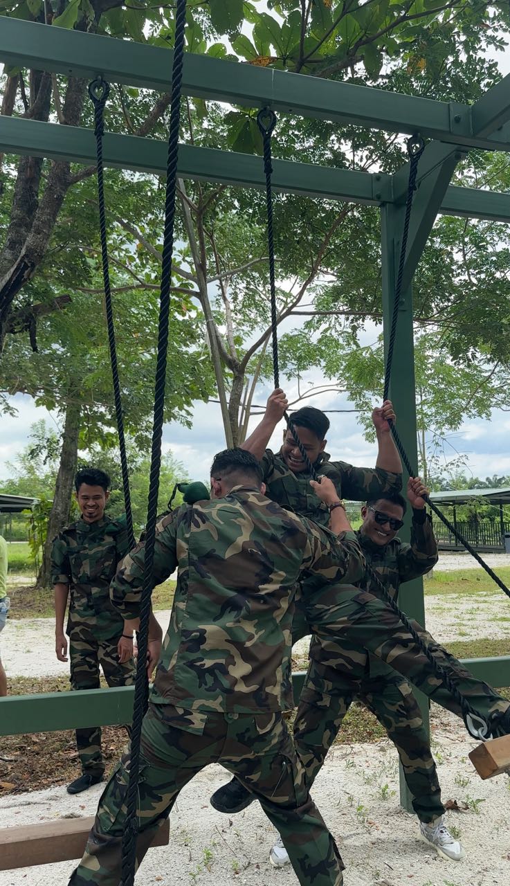 Participants playing one of the militray obstacles at escape ipoh