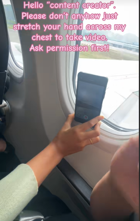 Passenger films from plane window