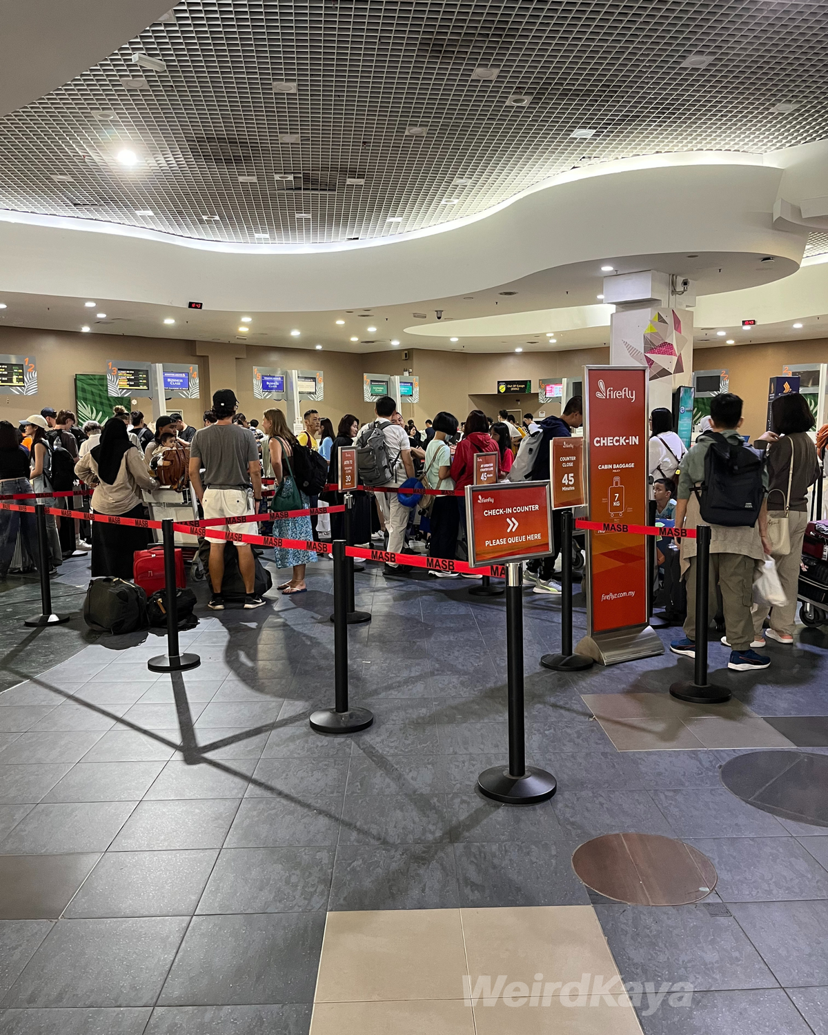 Passengers lining up at Penang International Airport