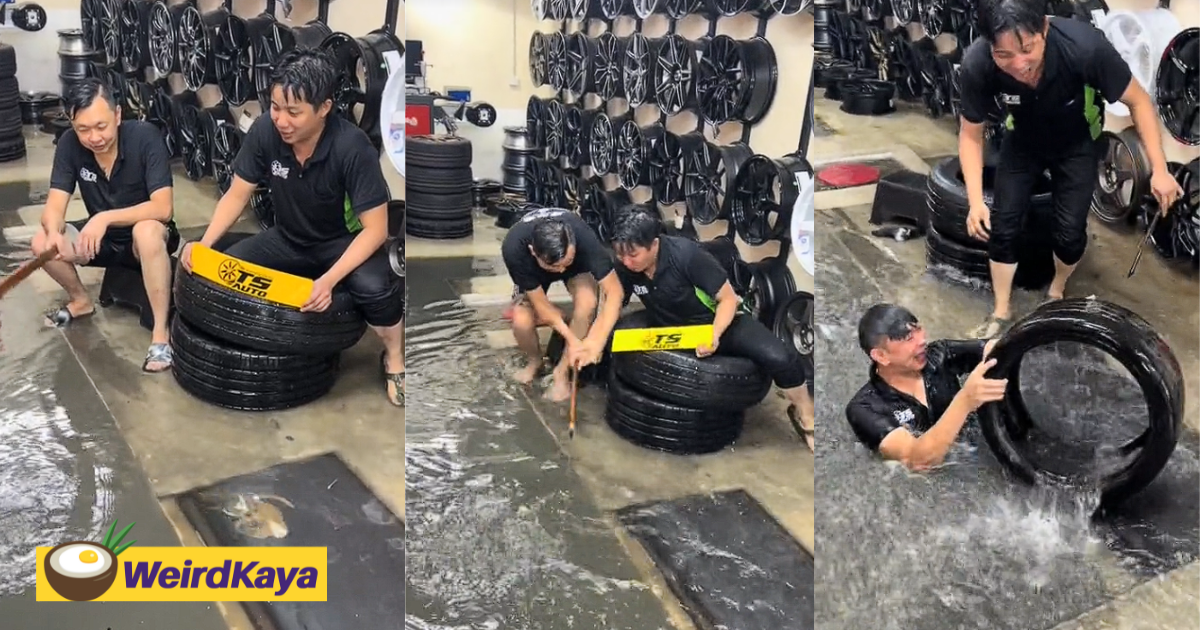 Penang mechanics go viral for fishing and diving in flooded tyre shop | weirdkaya