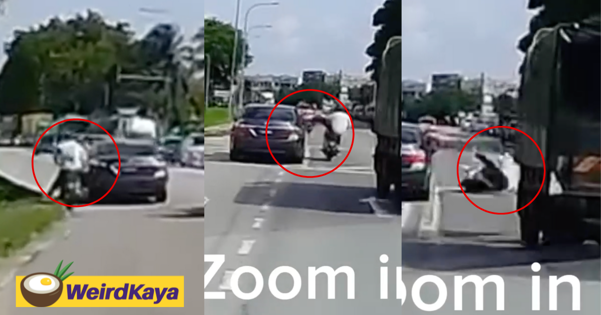 Penang motorcyclist nearly crushed by lorry after kicking a car which almost hit him | weirdkaya