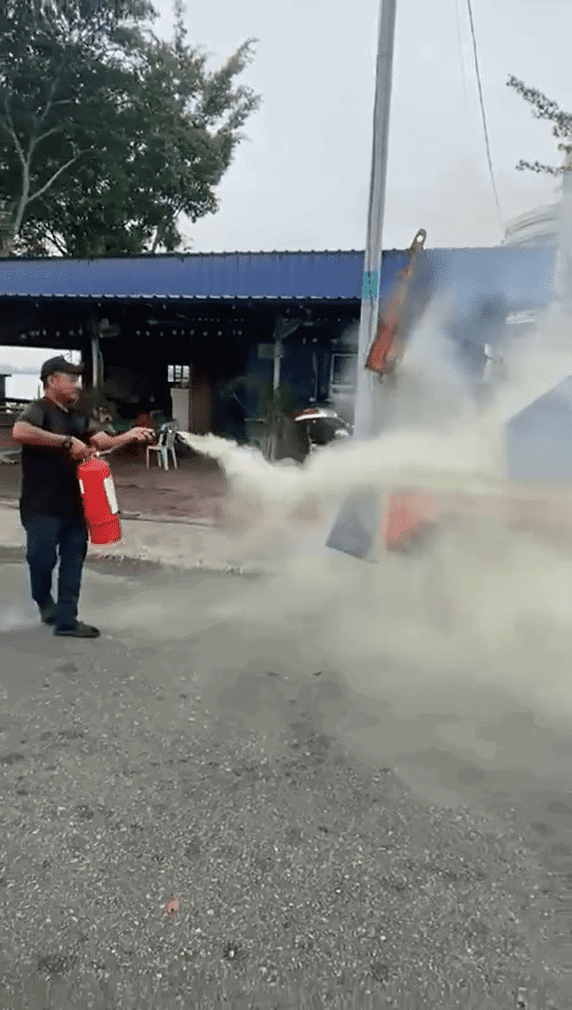 People putting out tow truck fire