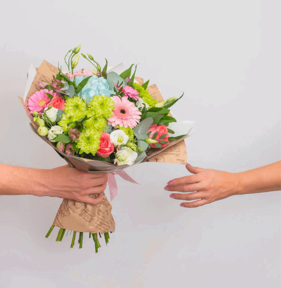 person giving flowers