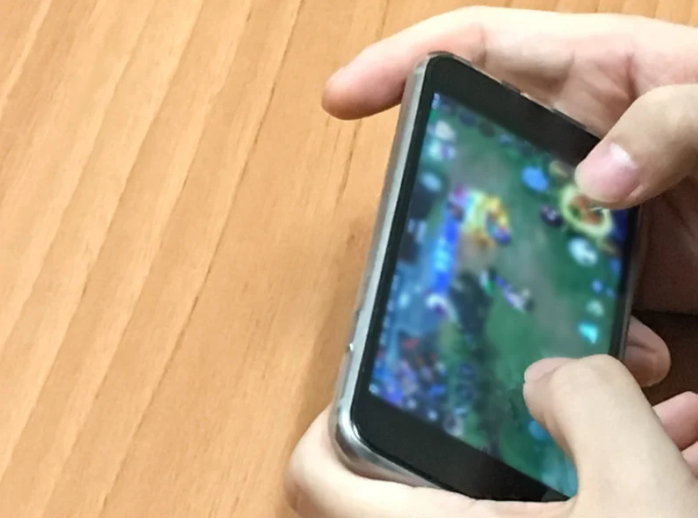 person playing mobile games