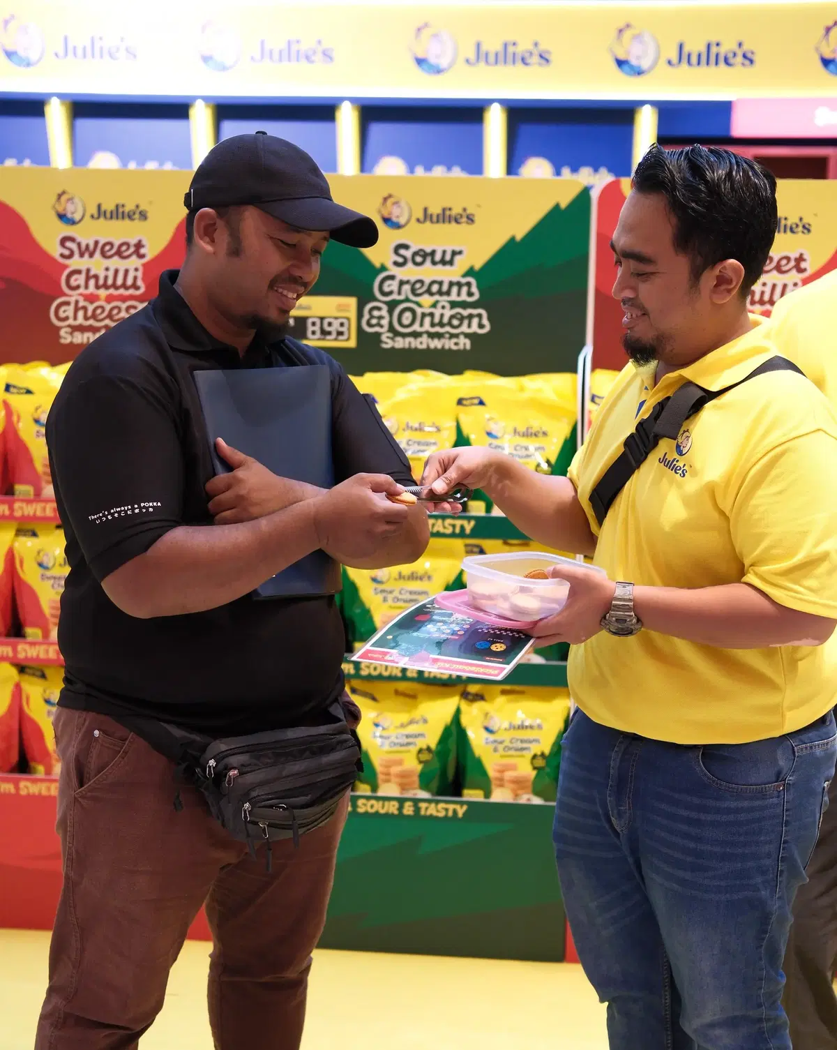 Visitors savouring the free sampling of Julies Sweet Chilli Cheese and Sour Cream & Onion Sandwich Biscuits