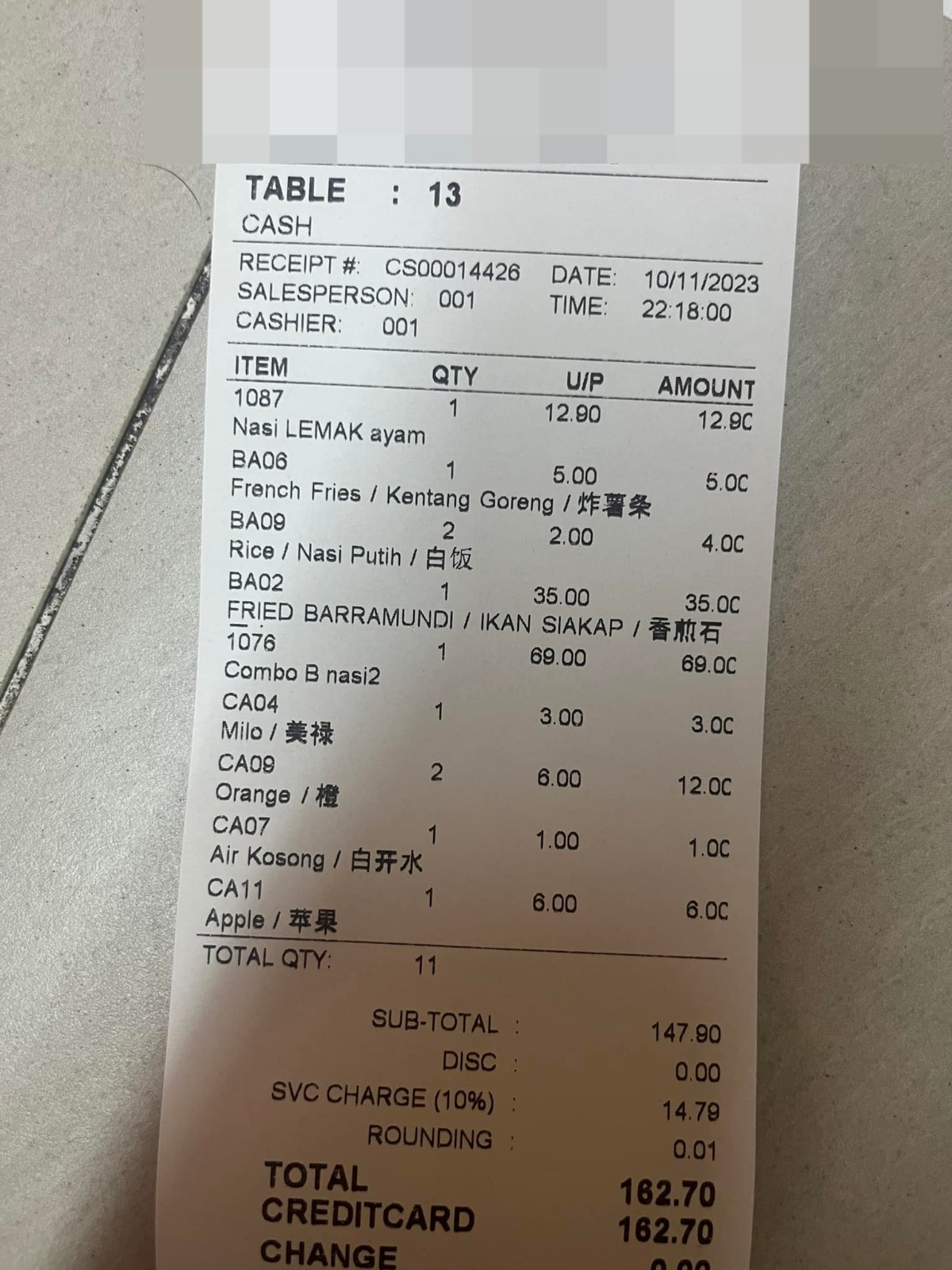 Restaurant owner showing another customer's receipt