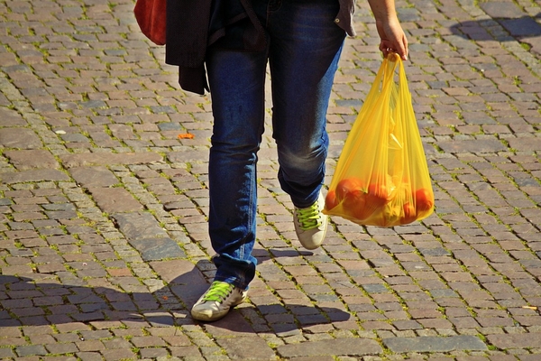 Man using plastic bag for shopping