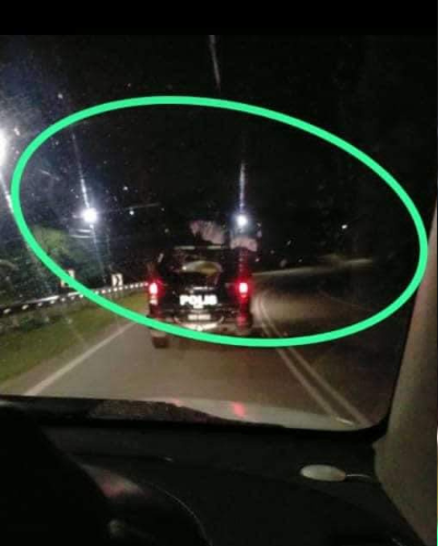 'pocong' spotted hitchhiking a ride on top of police car in rembau