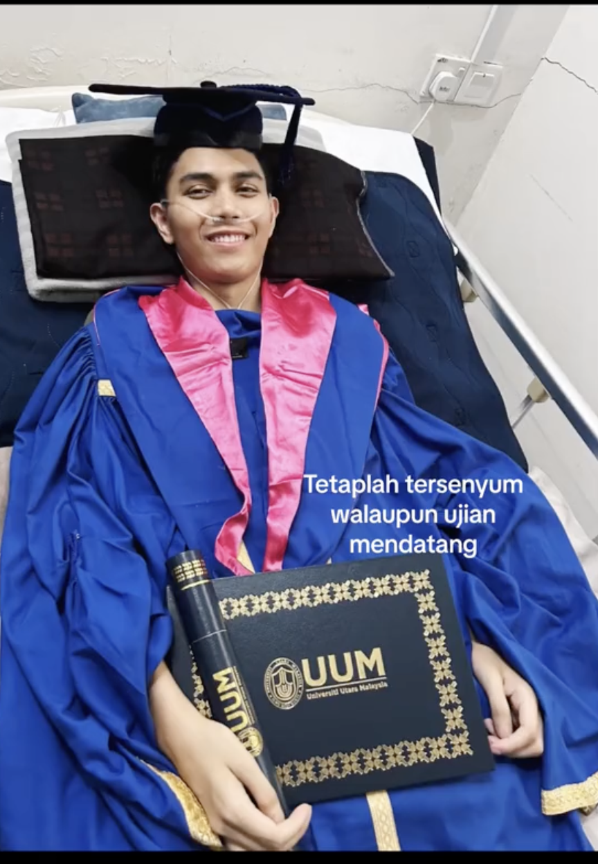 Rahman with his graduation gown at the hospital 2