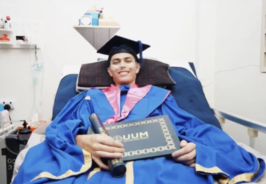Rahman with his graduation gown at the hospital