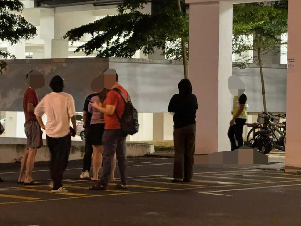 Residents gathering at Kampar apartment where student fell