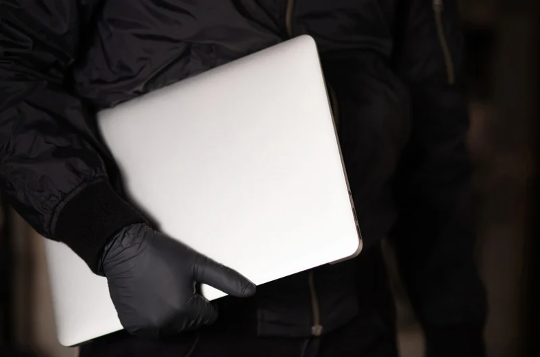 Robber carrying a laptop