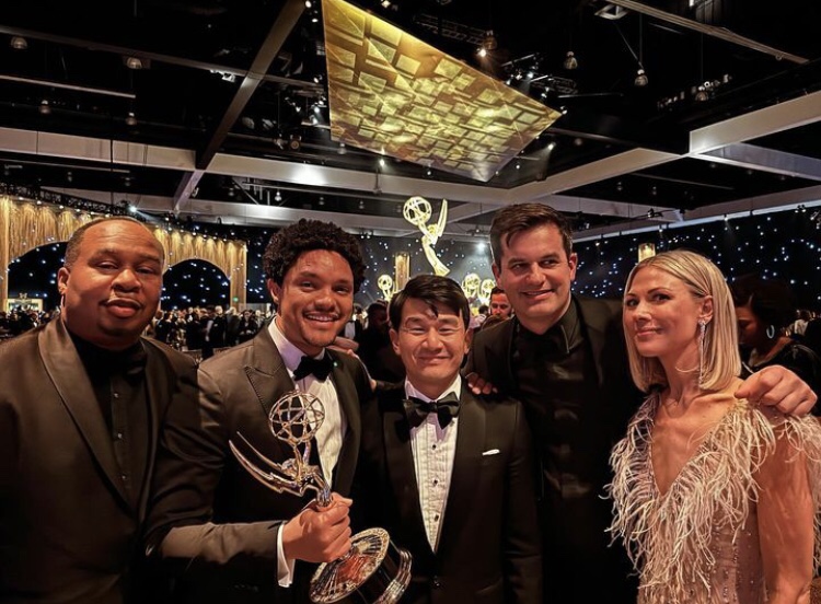 Ronny chieng posing for a photo with 'the daily show' team