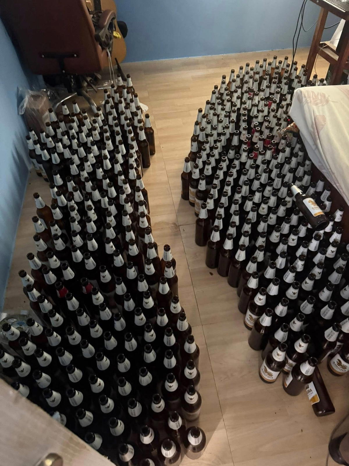 Rows of beer bottles found inside Thai man's room