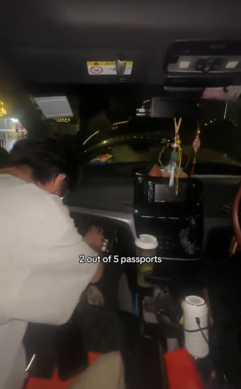 Sabrina's friends looking for passport inside car