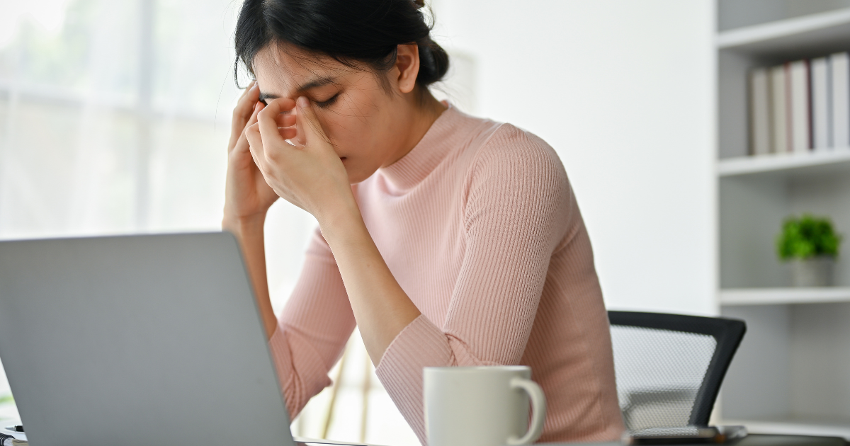 Sad woman looking at laptop