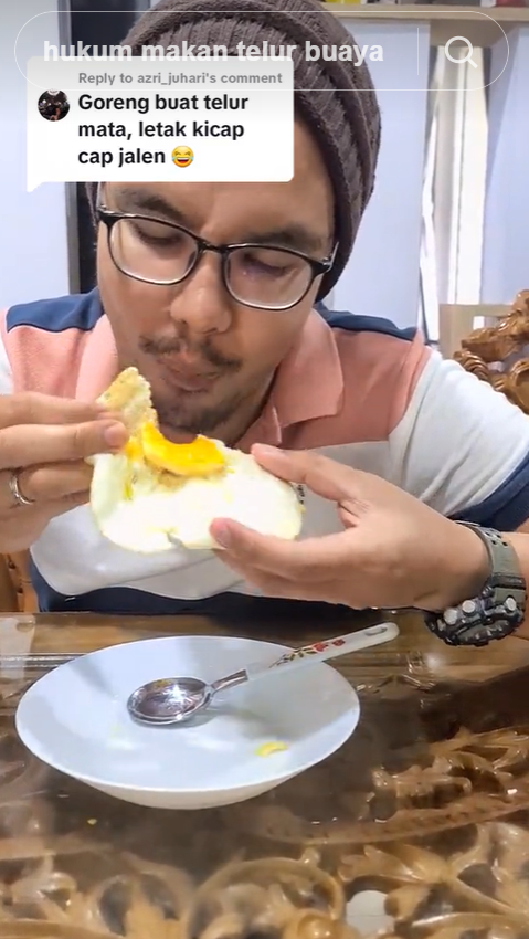 Malaysian man eating crocodile egg