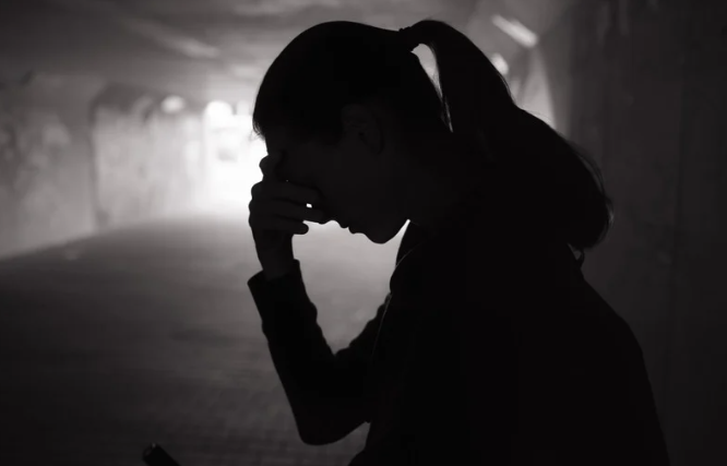 Woman covering her face