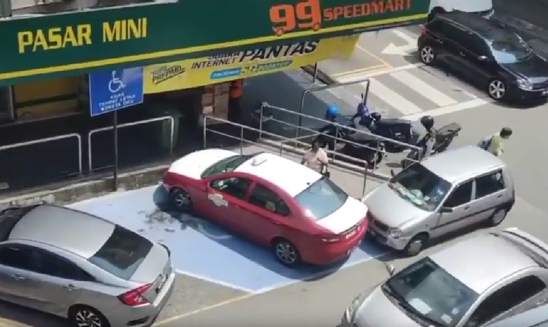 A taxi driver is heading to his car that was parked in the oku parking spot