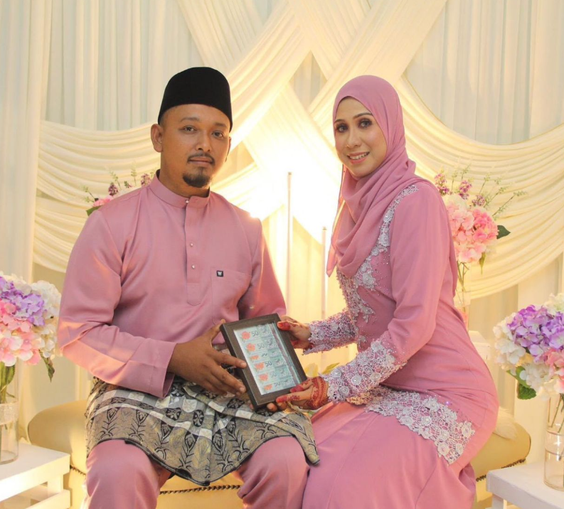 Msian couple at their wedding reception