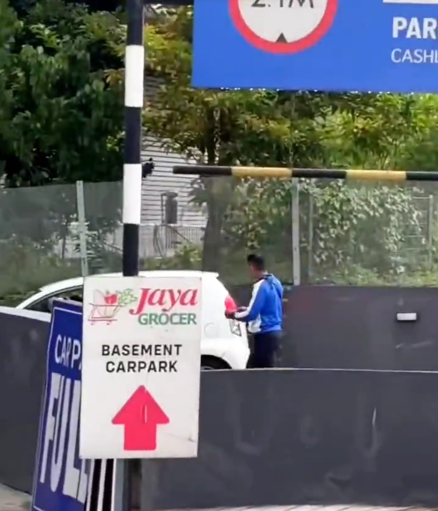 Myvi gets stuck in motorcycle lane at kl mall's parking entrance, netizens confused & amused