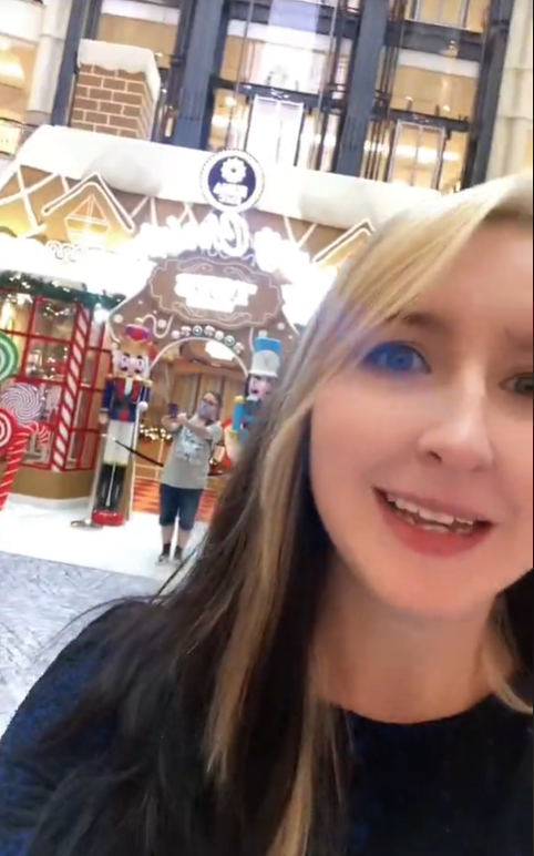 Us woman amazed by christmas decorations at kl mall
