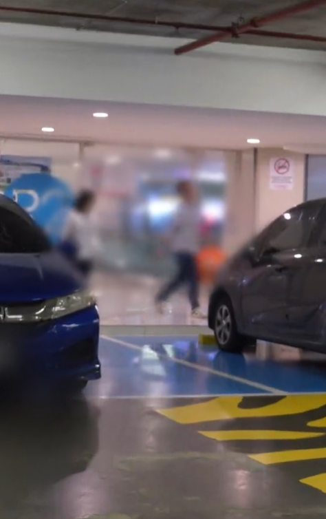 M'sian couple return to their car at oku parking lot at ioi city mall