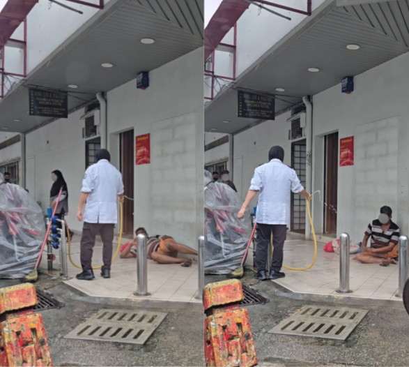 Security guard splashes homeless man with water