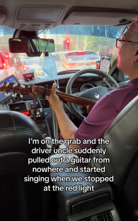 Sg grab driver sings for passenger with guitar