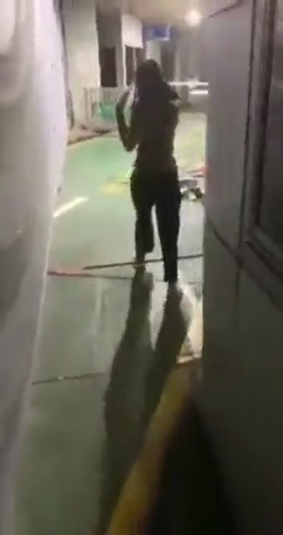 Woman caught urinating behind a wall at jb customs, gets slammed for her lack of hygiene