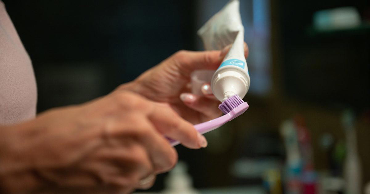 squeezing toothpaste