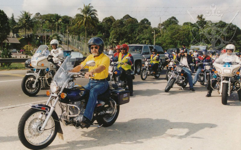 Sultan ibrahim sultan iskandar riding a motorcycle during the kembara mahkota johor expedition