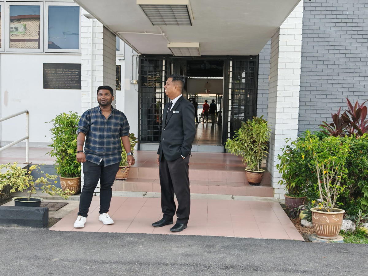 surenthiran with his lawyer at the court