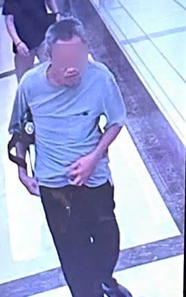 suspect holding a bag