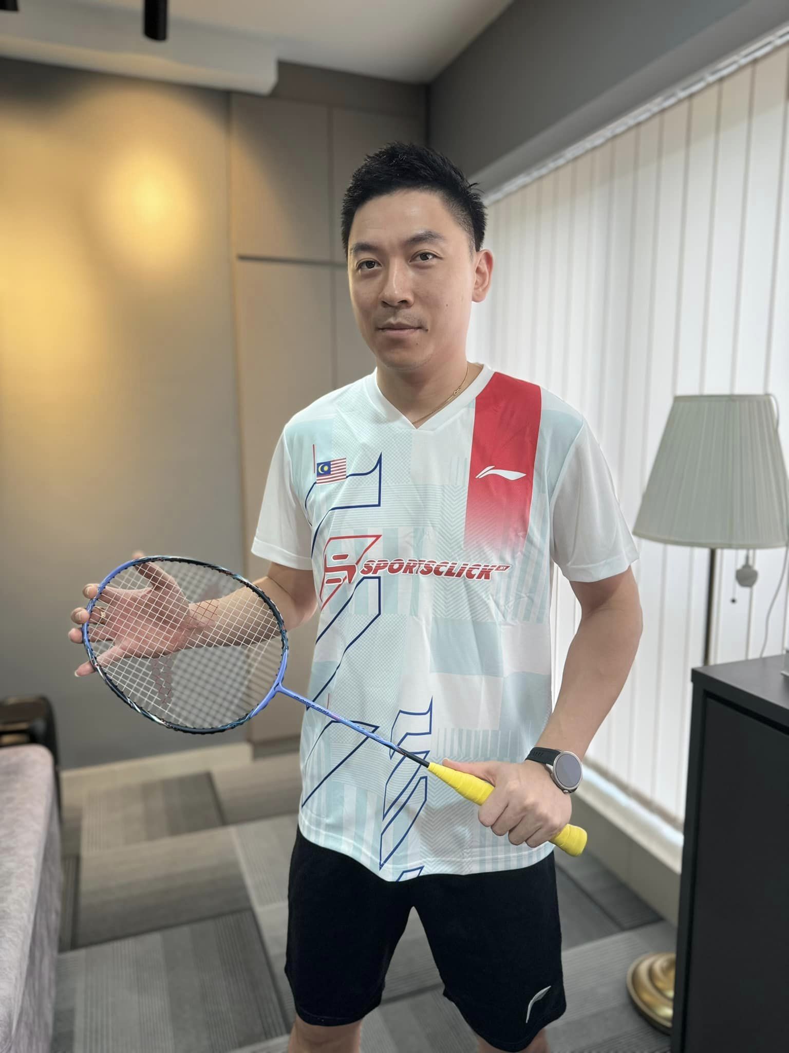 Tan boon heong holding a racquet