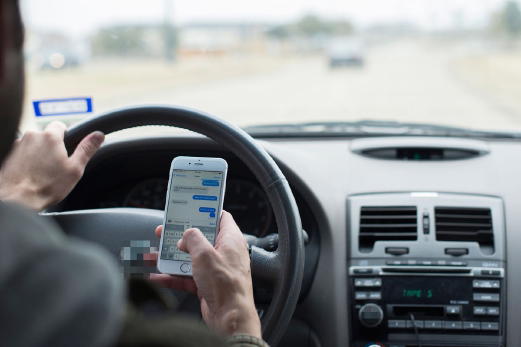 Person texting while driving