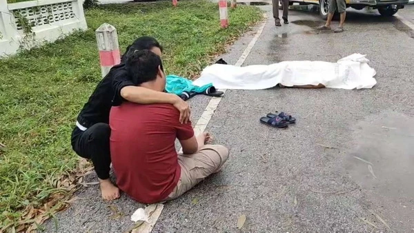 Thai man mourning over mum's corpse