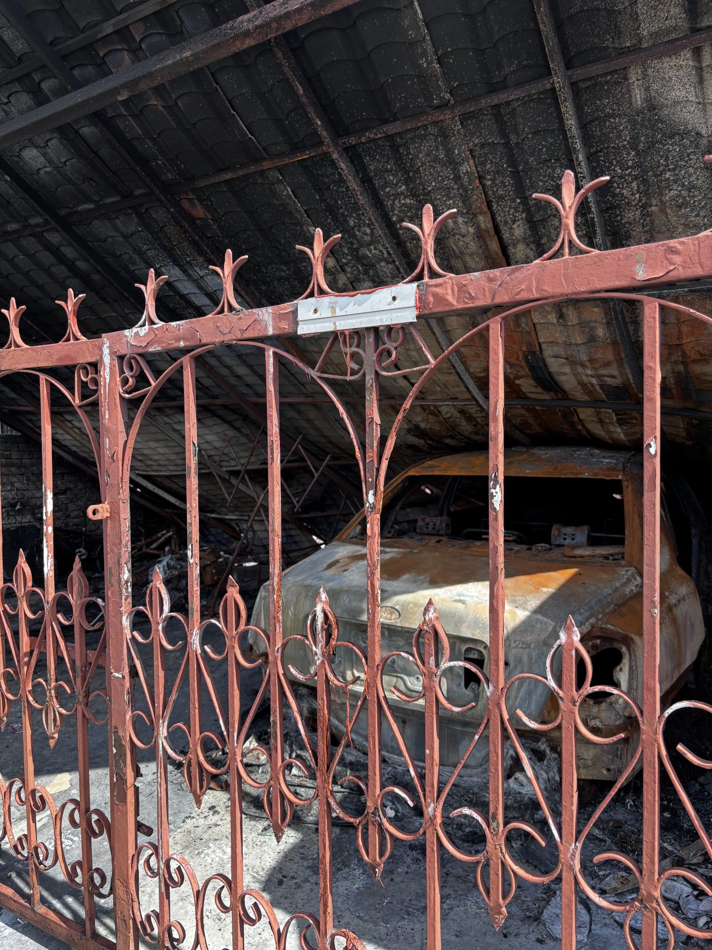 the gate of the the house burned down