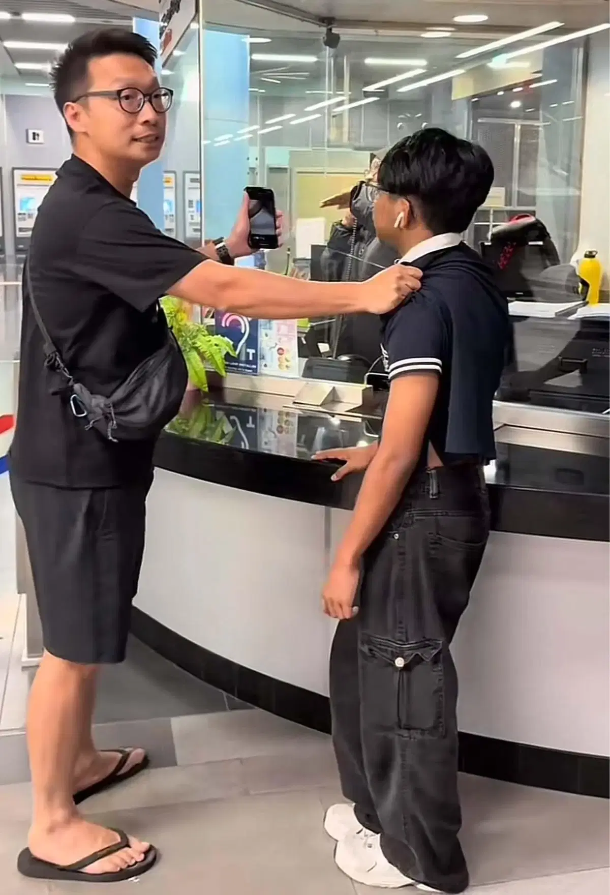 the husband talking to the person in charge