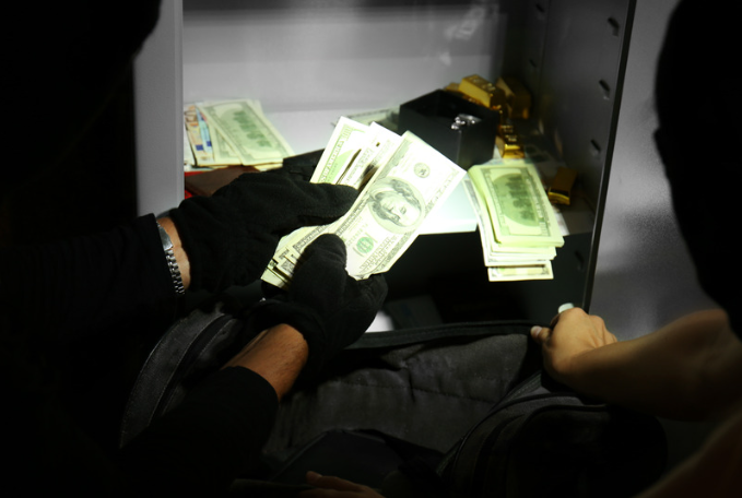 Thief stealing money