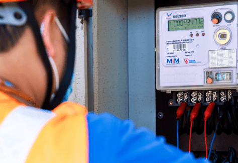 Person inspecting an electricity meter