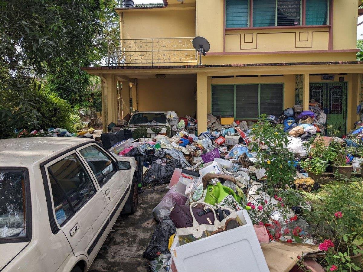 Tons of trash flooding m'sian woman's home in penang