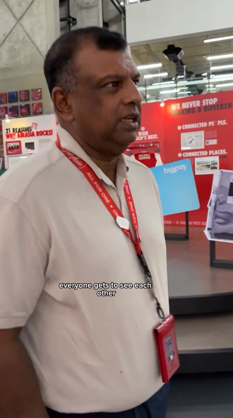 Tony fernandes saying explaining about an open space at his airasia facility
