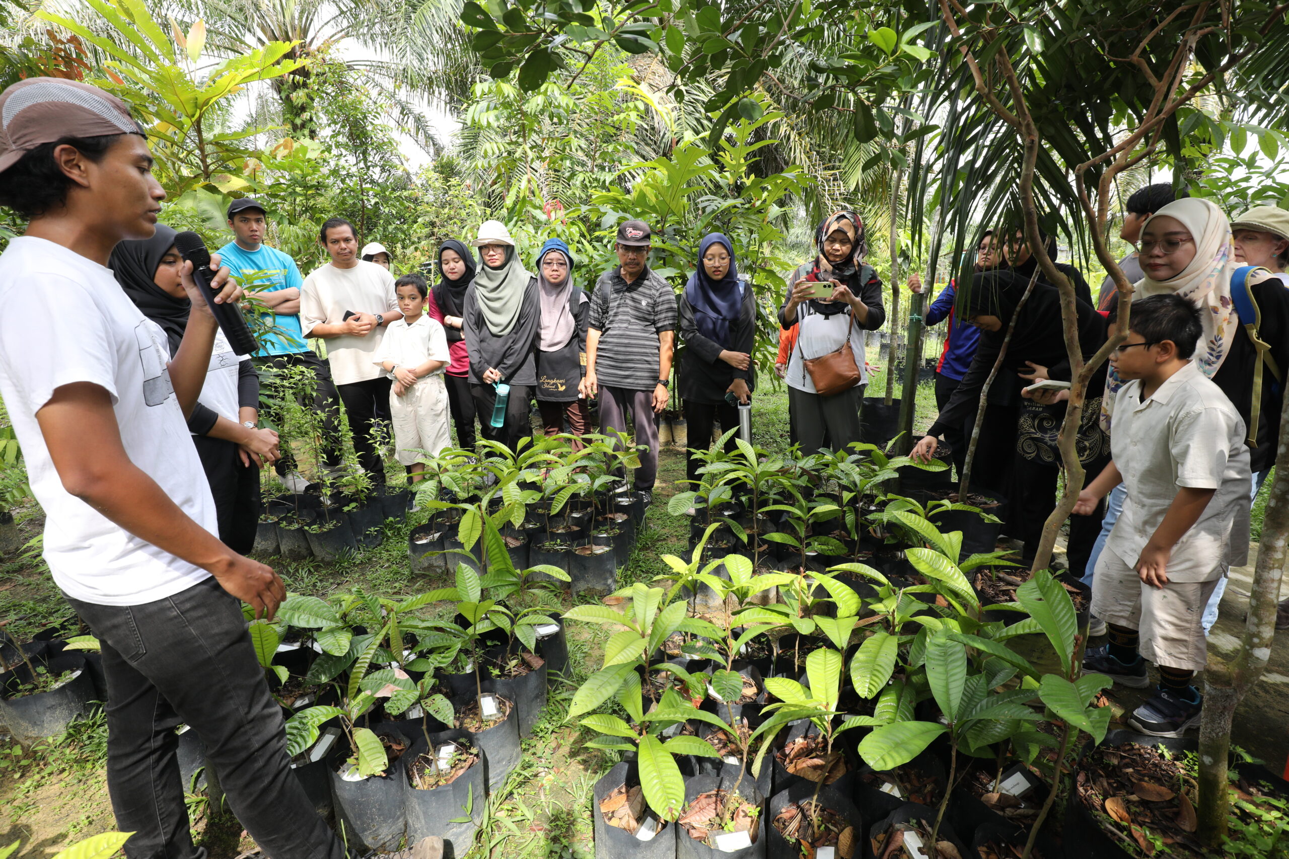 Trcrc staff explaining about the plants at the elmina living collection nursery