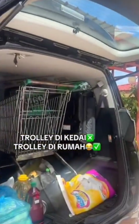 A trolley seen placed inside the car boot